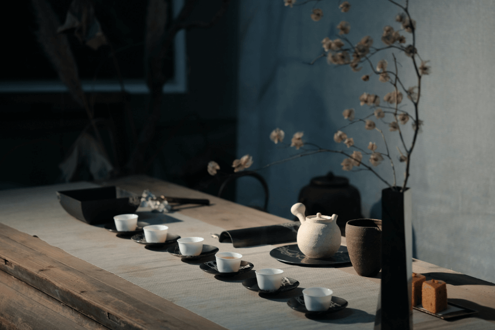 Six cups arranged for elegant tea ceremony.